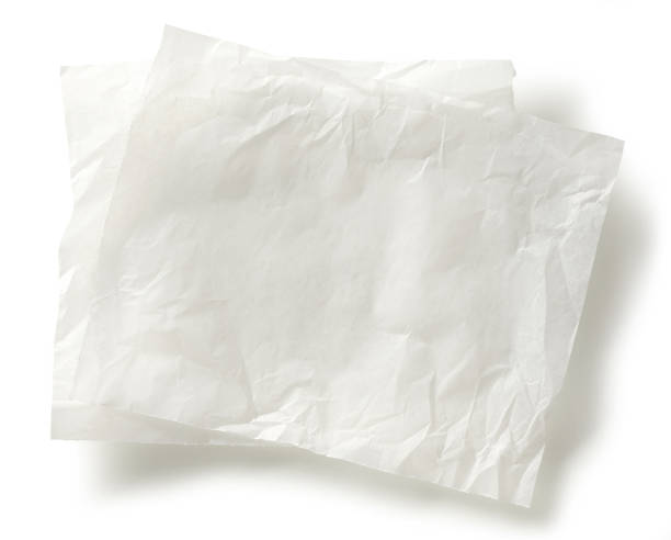 istock white baking paper sheets isolated on white background, top view 1292815493