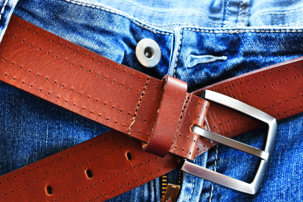 istock Leather Belt and Faded Blue Jeans 1292815619