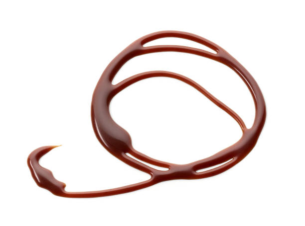 istock melted chocolate sauce isolated on white background, top view 1292816398