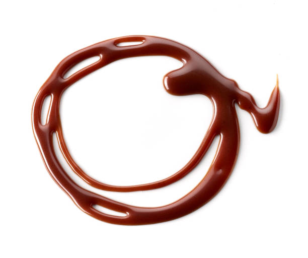 istock melted chocolate sauce isolated on white background, top view 1292816412