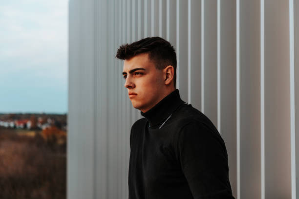 istock Serious looking pensive young man looking to the horizon 1292816499