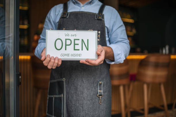 istock Business owner opening his working place. 1292816568
