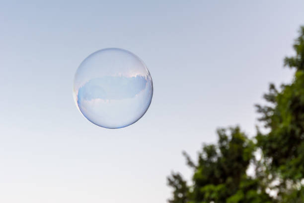 istock A soap bubble flying in the blue and clean sky 1292817386