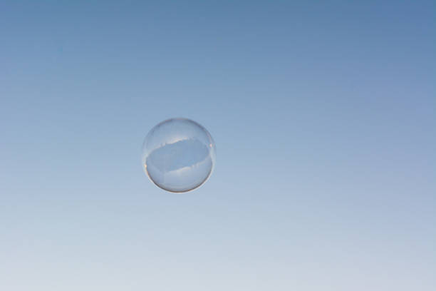 istock A soap bubble flying in the blue and clean sky 1292817388
