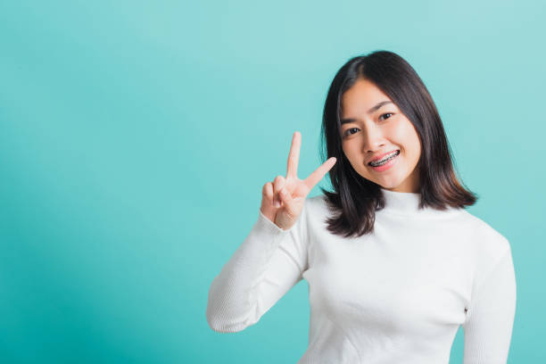 istock Portrait female give V-sign 1292817562