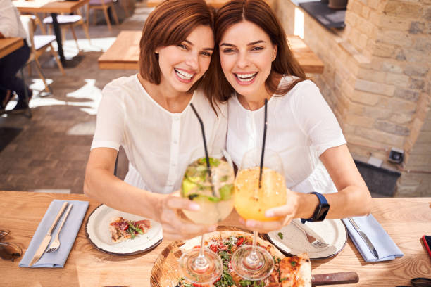 istock Girls toasting glasses with smoothie 1292817686