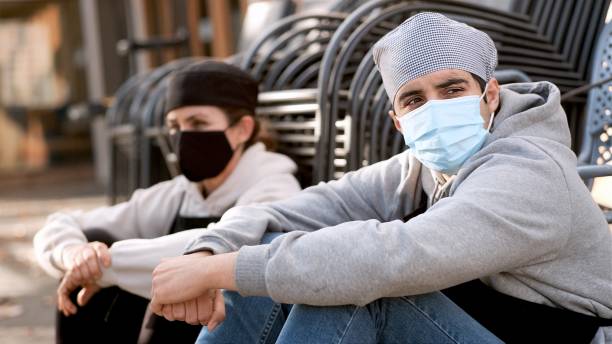 istock Young cook posing with a female mature coworker wearing both protective face masks 1292821189
