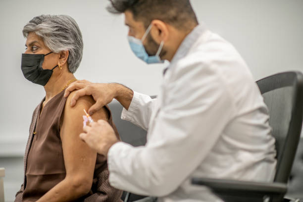 istock Senior woman getting COVID-19 vaccine 1292822194