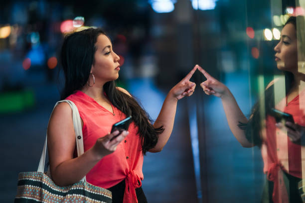 istock Young woman window shopping. 1292825979