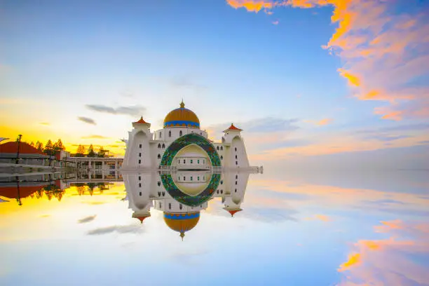 Photo of Majestic view of Malacca Straits Mosque during sunset.