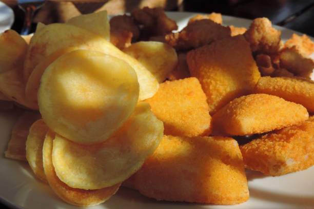 istock beer snacks : chips ,nachos, Pads stuffed with cheddar cheese and hot jalapenos and fried chicken ball 1292831719