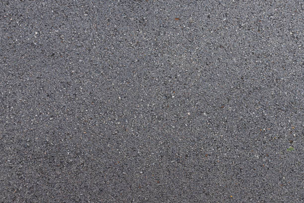 istock new surface grunge rough asphalt black dark grey road street texture Background,Top view abstract Seamless tarmac 1292833484
