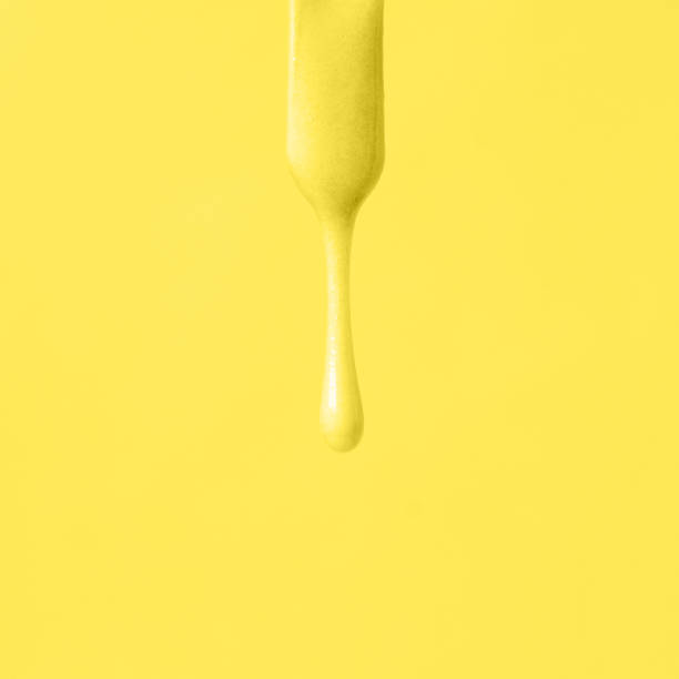 istock liquid pink wax or sugar paste for depilation drains from the stick on pink background. The concept of depilation, waxing, sugaring smooth skin, beauty, cream, banner, copy space, monochrome 1292834355