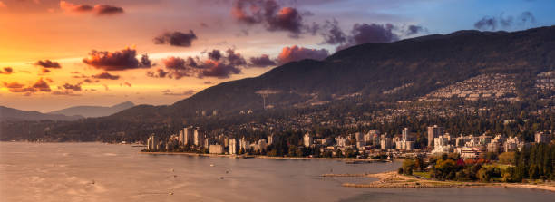 West Vancouver, British Columbia, Canada West Vancouver, British Columbia, Canada. Aerial Panoramic View of a modern cityscape on the Pacific Ocean Coast during an Autumn sunny and cloudy sunset. west vancouver stock pictures, royalty-free photos & images