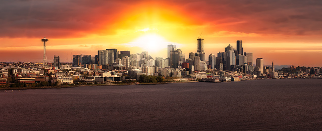 Downtown Seattle, Washington, United States of America. Aerial Panoramic View of the Modern City on the Pacific Ocean Coast. Dramatic Sunrise Sky Art Render.