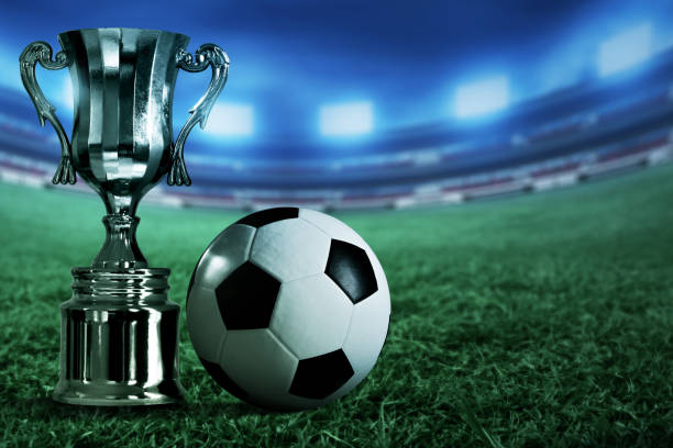istock Champion trophy cup with soccer ball 1292846221