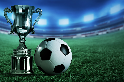 Champion trophy cup with soccer ball
