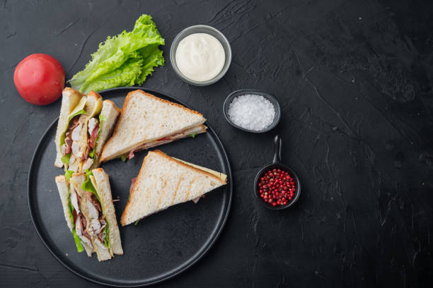 istock Classic club sandwich, on black background, top view with copy space for text 1292852036