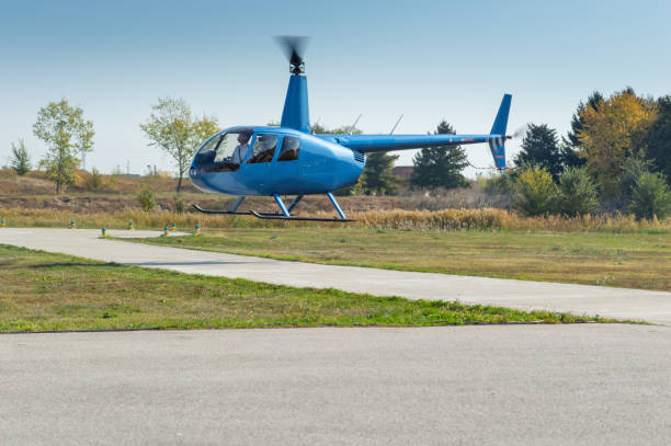 istock Helicopter mid-air taking off from the airfield 1292852121