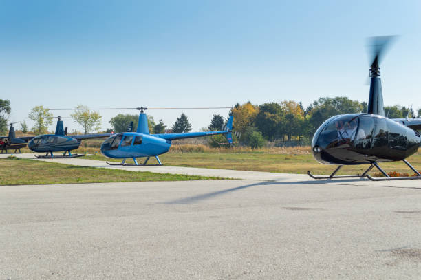 istock Helicopters landing on the helipad in a row 1292852131