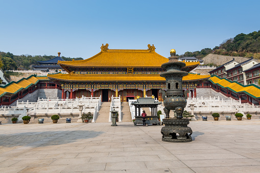 Chinese traditional royal style colorful temples in the Putuoshan mountains, Zhoushan Islands,  a renowned site in Chinese bodhimanda of the Guanyin