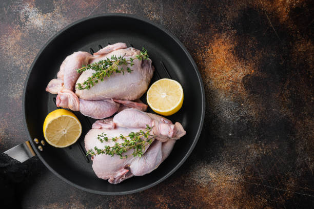 istock Fresh whole poult on grill pan, on old rustic background, top view with copy space for text 1292853370