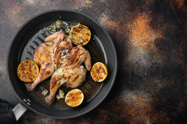 istock Roasted spatchcock poussin, on old rustic background, top view with copy space for text 1292854074