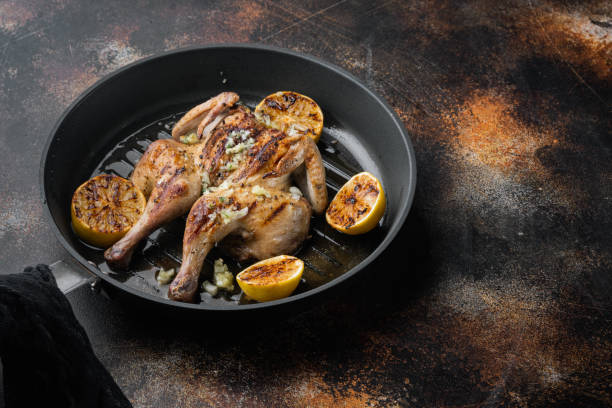 istock Homemade chicken rotisserie with thyme, lemon, on old rustic background with copy space for text 1292855333