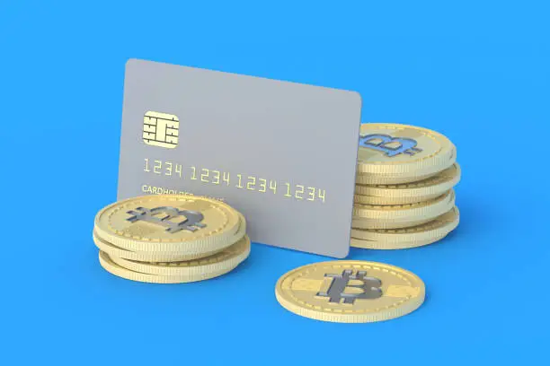 Photo of Credit card and coin of bitcoin on blue background. Anonymous, alternative payment currency. Cashing out virtual money. Untraceable international transfers. 3d rendering
