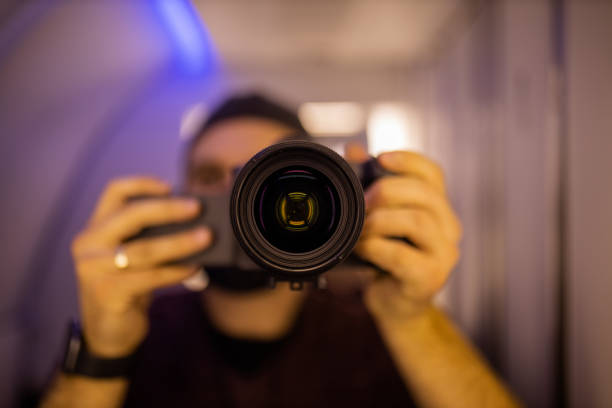 istock Man taking self-portrait inside an airplane bathroom 1292857407