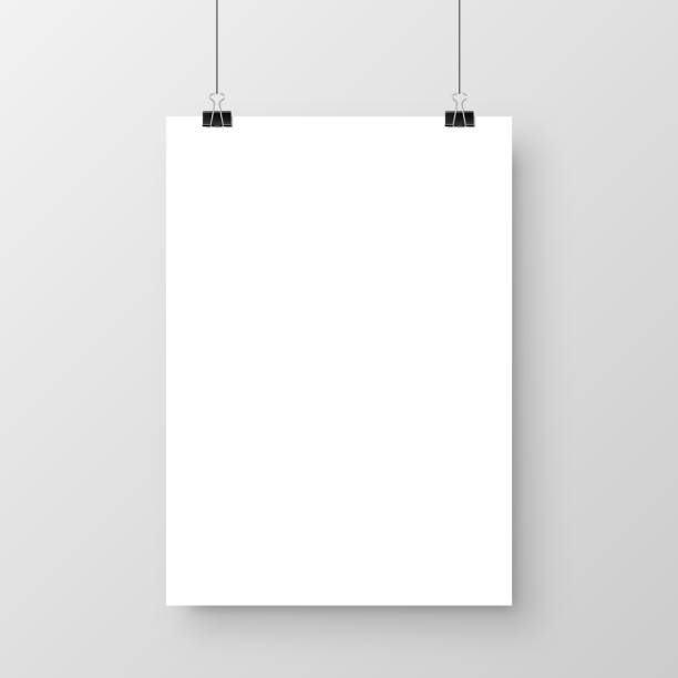 istock Realistic hanging blank paper sheet with shadow in A4 format and black paper clip, binder on gray background. Design poster, template or mockup. Vector illustration 1292859387