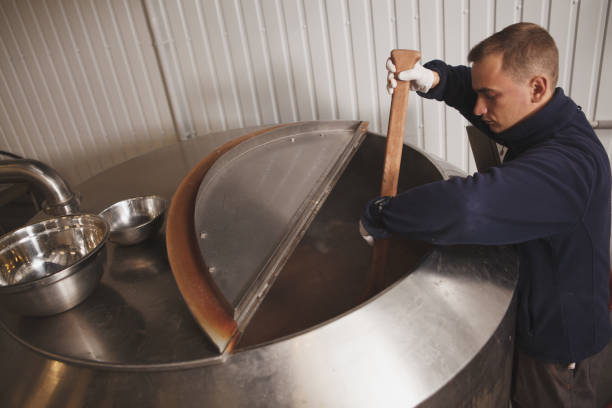 istock Brewer working at craft beer factory 1292860238