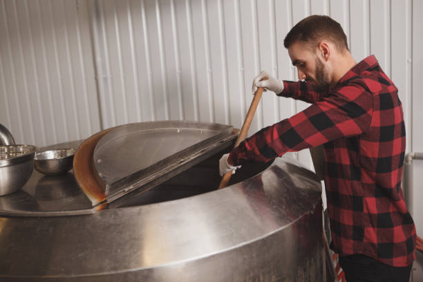 istock Brewer working at craft beer factory 1292860539