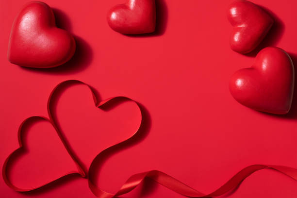 istock Valentine day composition with gift box and red hearts, photo template on red background. 1292862440