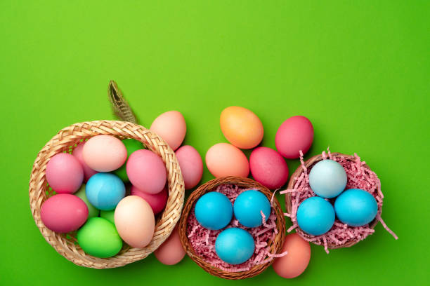 istock Easter eggs in a nest on green background 1292866503