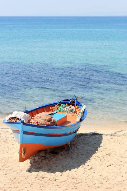 istock Fishing boat stranded on the beach 1292867527