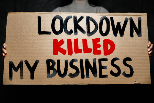 istock Protestive placard against coronavirus lockdowns against grey background 1292867658