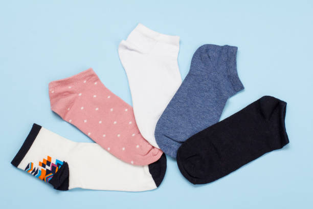 istock Five pair of women socks on blue background. 1292868848