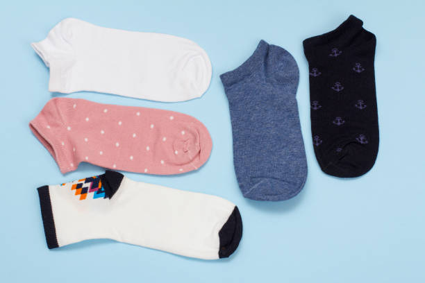istock Five pair of women socks on blue background. 1292868985
