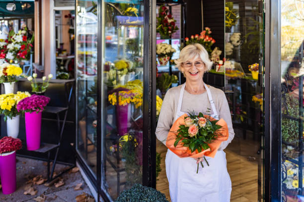 istock Beautiful flowers shop owner 1292869346
