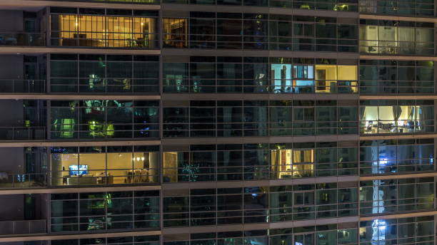 istock Glowing windows of skyscrapers at evening 1292870446