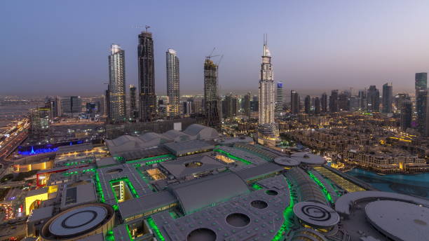 Dubai downtown day to night . Top view from above