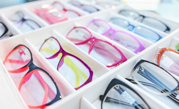 istock Colorful eyeglasses sorted in box at optical shop 1292871283