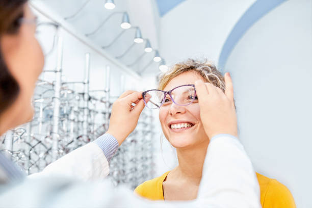istock Trying eyeglasses in an optical shop and finding the right frame 1292871448
