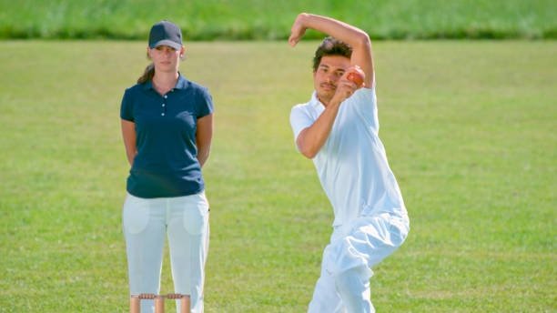 istock Bowler bowling cricket ball 1292871547