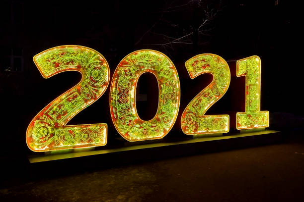 istock luminous number 2021 in the evening park 1292872429