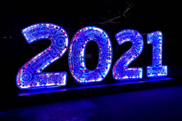 istock luminous number 2021 in the evening park 1292872433