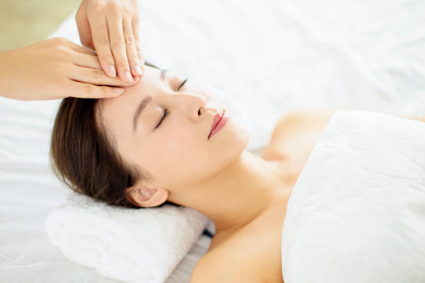 istock relaxed Young woman enjoy massage in spa salon 1292873693