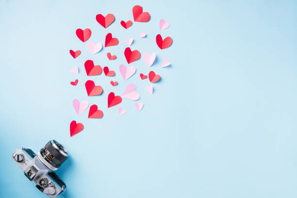istock retro camera and paper flying elements hearts cut greeting gift card 1292873932