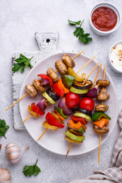 istock Vegetarian skewers with different grilled vegetables. 1292874975